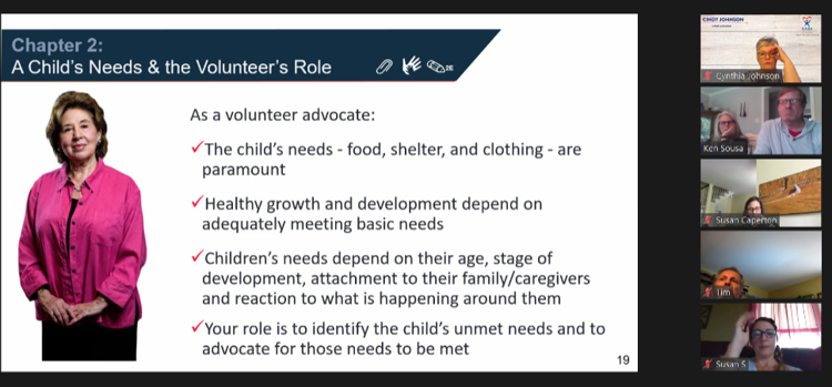 A volunteer advocate presents information about a child's needs and the volunteer's role during an educational workshop or training session.