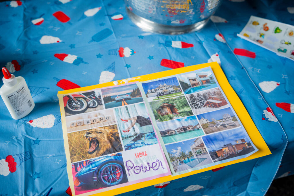 A travel brochure with multiple destination photographs is displayed on a bright blue surface scattered with colorful confetti, creating a festive travel-themed composition.