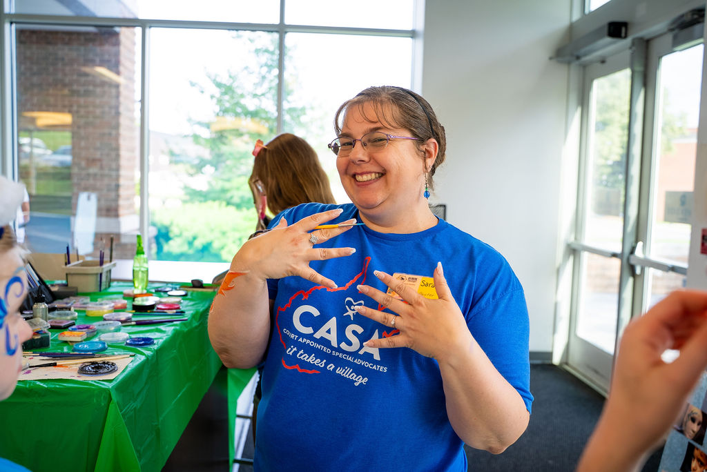 A CASA-EP mentor working with a youth at the 2026 Youth Leadership Summit